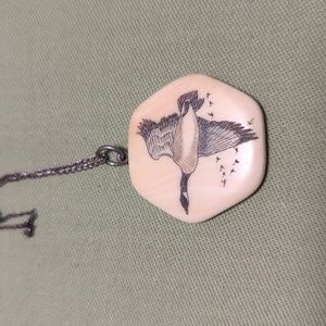 Vintage scrimshaw goose pendant